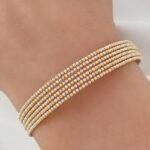 ⁦اسوارة دوريكا ذهب عيار 18، وزن 7.45 جم مقاس 17 بتصميم ايطالي ثلاثي الألوان ومرصعة بفصوص براقة⁩ - الصورة ⁦2⁩