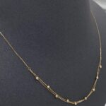 ⁦عقد دورين ذهب عيار 18 الوزن 0.94 جرام⁩ - الصورة ⁦5⁩