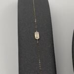 ⁦عقد وإسواره ذهب عيار 18 الوزن 0.84 جرام⁩ - الصورة ⁦2⁩