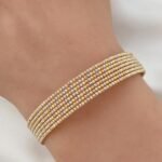 ⁦اسواره ذهب دوريكا عيار 18 وزن 8.72 جم مقاس 17 تصميم كور ملونة تضفي أناقة عصرية⁩ - الصورة ⁦2⁩